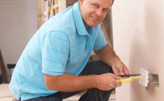 Electrician Installing Wall Socket