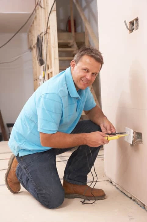 Electrician Installing Wall Socket